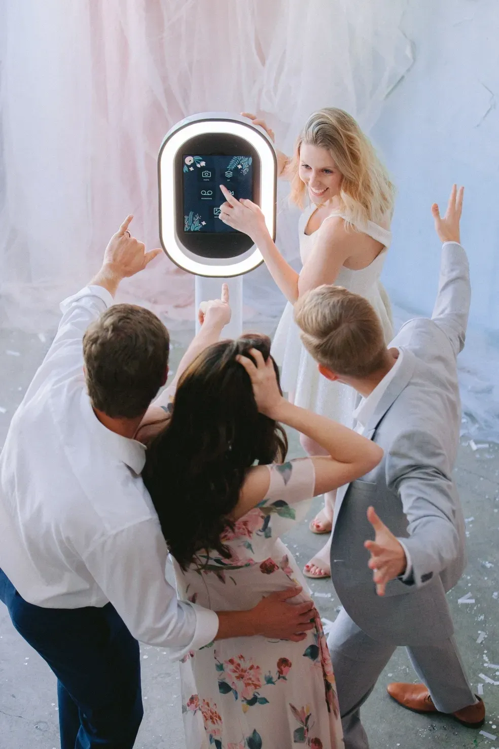 Guests gathered around the GrinBin interactive photobooth